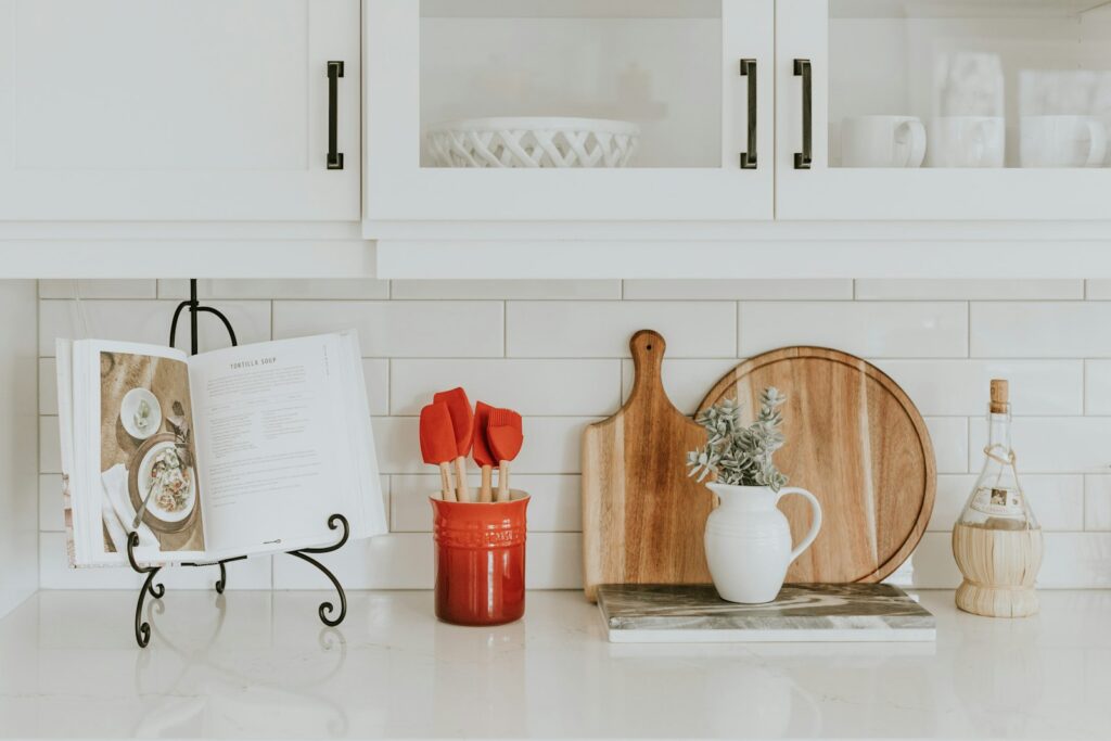 Clean, organized kitchen counter with cutting boards and utensils